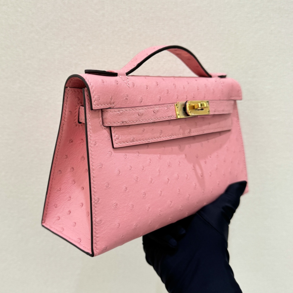 The Hermès Mini Kelly I (also known as the Kelly Pochette) Ostrich Leather Handbag is one of the brand's classic exotic leather models.