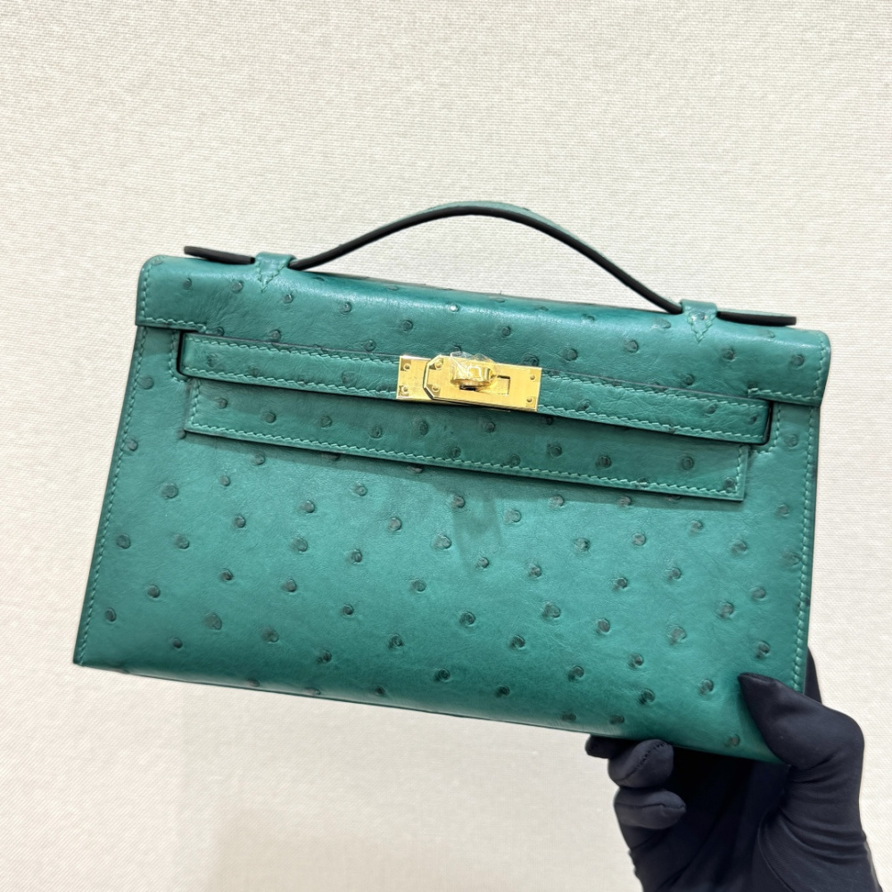 The Hermès Mini Kelly I (also known as the Kelly Pochette) Ostrich Leather Handbag is one of the brand's classic exotic leather models.