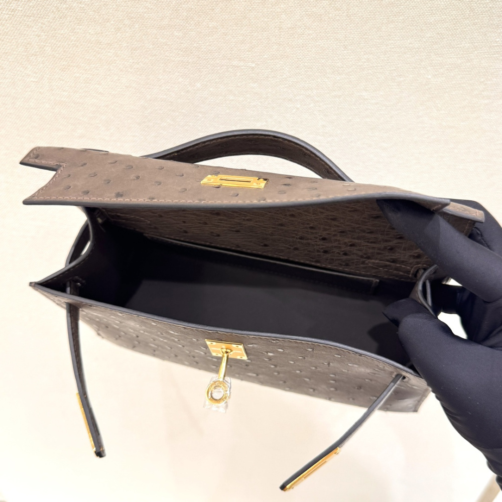 The Hermès Mini Kelly I (also known as the Kelly Pochette) Ostrich Leather Handbag is one of the brand's classic exotic leather models.