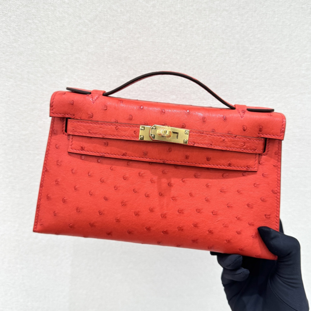 The Hermès Mini Kelly I (also known as the Kelly Pochette) Ostrich Leather Handbag is one of the brand's classic exotic leather models.