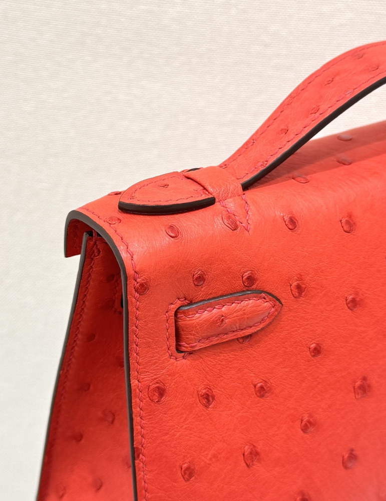 The Hermès Mini Kelly I (also known as the Kelly Pochette) Ostrich Leather Handbag is one of the brand's classic exotic leather models.