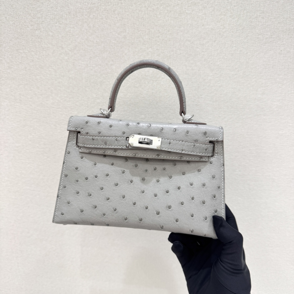 The Hermès Mini Kelly I (also known as the Kelly Pochette) Ostrich Leather Handbag is one of the brand's classic exotic leather models.