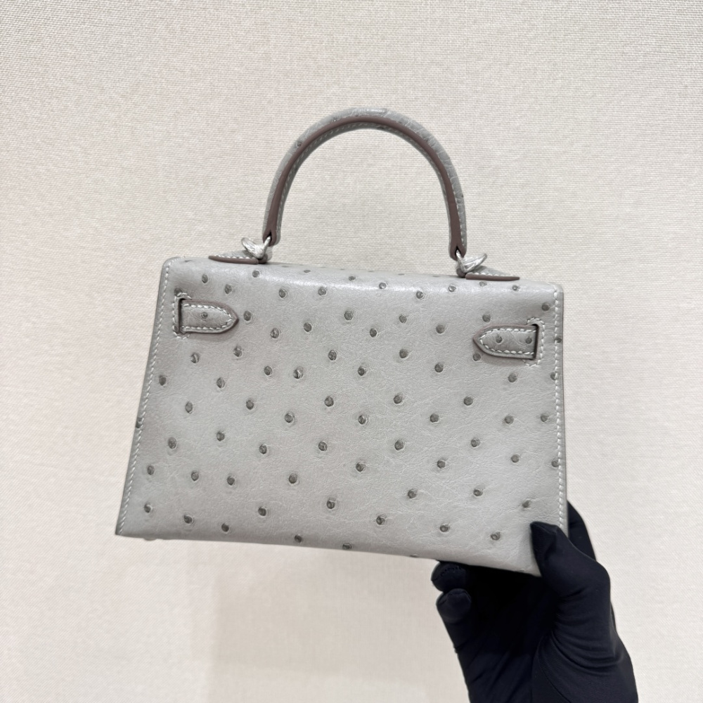 The Hermès Mini Kelly I (also known as the Kelly Pochette) Ostrich Leather Handbag is one of the brand's classic exotic leather models.
