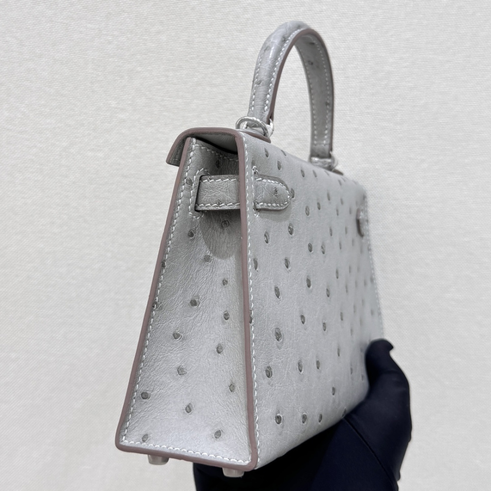 The Hermès Mini Kelly I (also known as the Kelly Pochette) Ostrich Leather Handbag is one of the brand's classic exotic leather models.