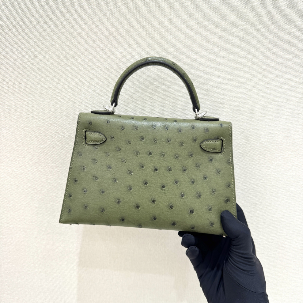 The Hermès Mini Kelly I (also known as the Kelly Pochette) Ostrich Leather Handbag is one of the brand's classic exotic leather models.