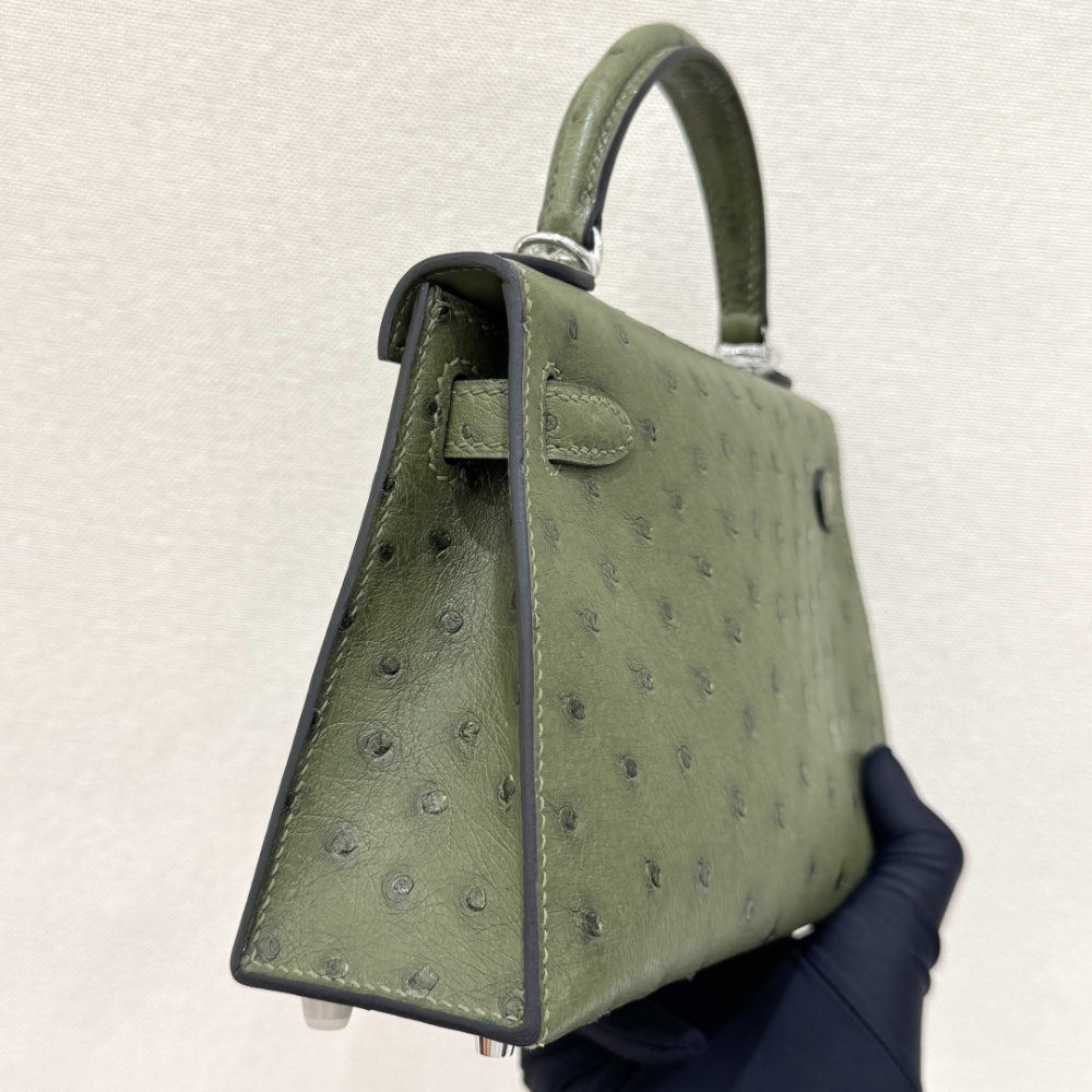 The Hermès Mini Kelly I (also known as the Kelly Pochette) Ostrich Leather Handbag is one of the brand's classic exotic leather models.