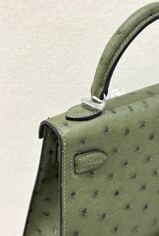 The Hermès Mini Kelly I (also known as the Kelly Pochette) Ostrich Leather Handbag is one of the brand's classic exotic leather models.