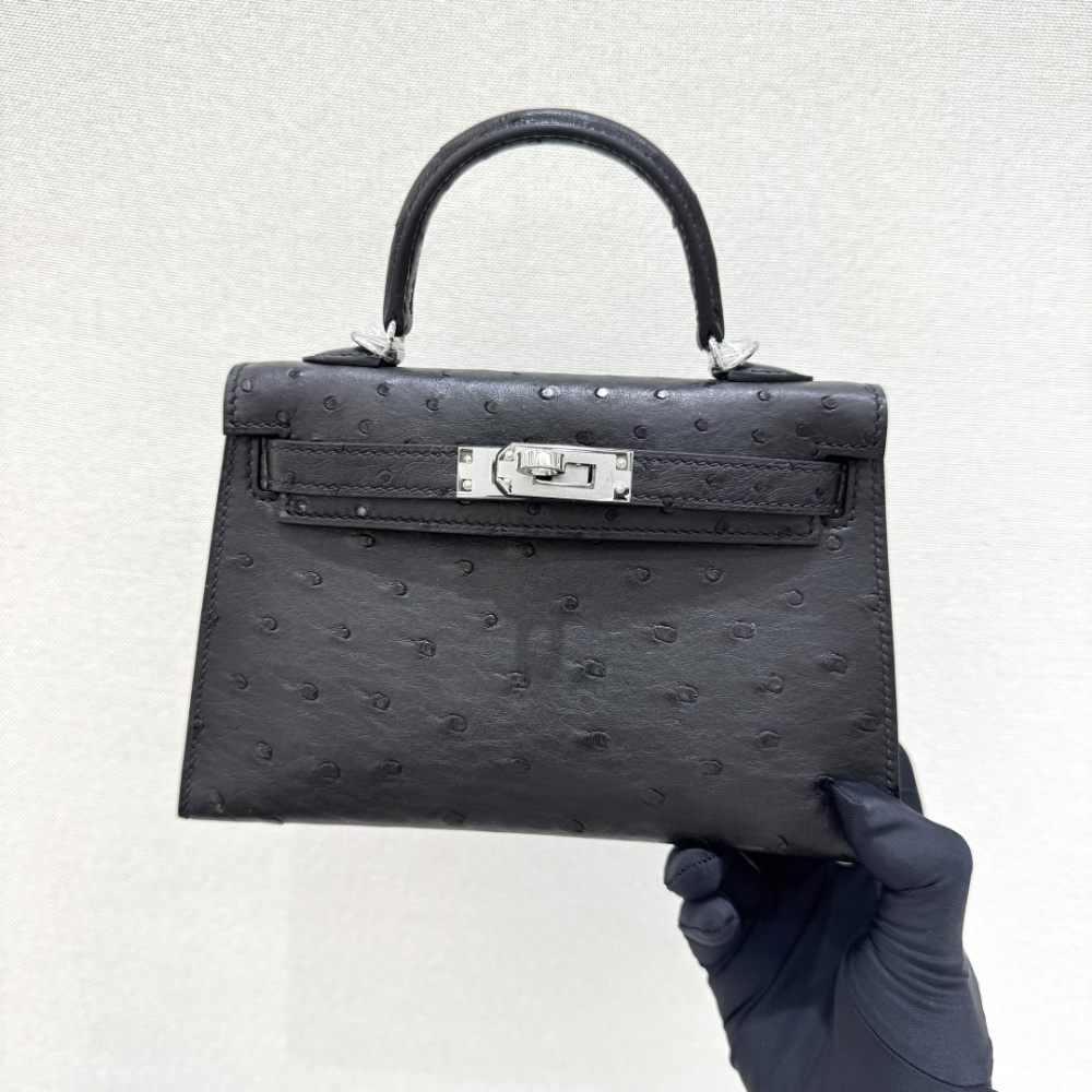The Hermès Mini Kelly I (also known as the Kelly Pochette) Ostrich Leather Handbag is one of the brand's classic exotic leather models.