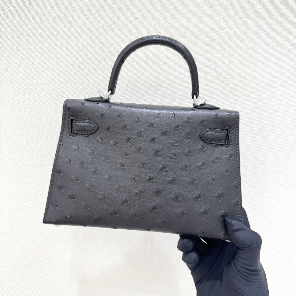The Hermès Mini Kelly I (also known as the Kelly Pochette) Ostrich Leather Handbag is one of the brand's classic exotic leather models.