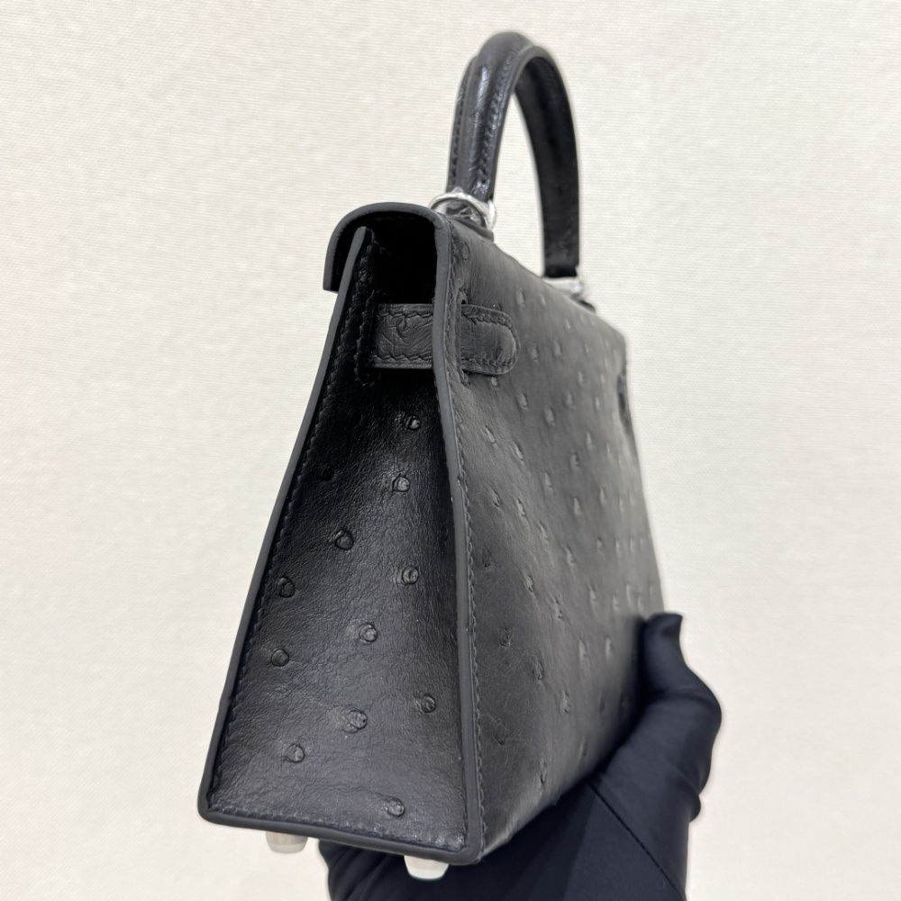 The Hermès Mini Kelly I (also known as the Kelly Pochette) Ostrich Leather Handbag is one of the brand's classic exotic leather models.