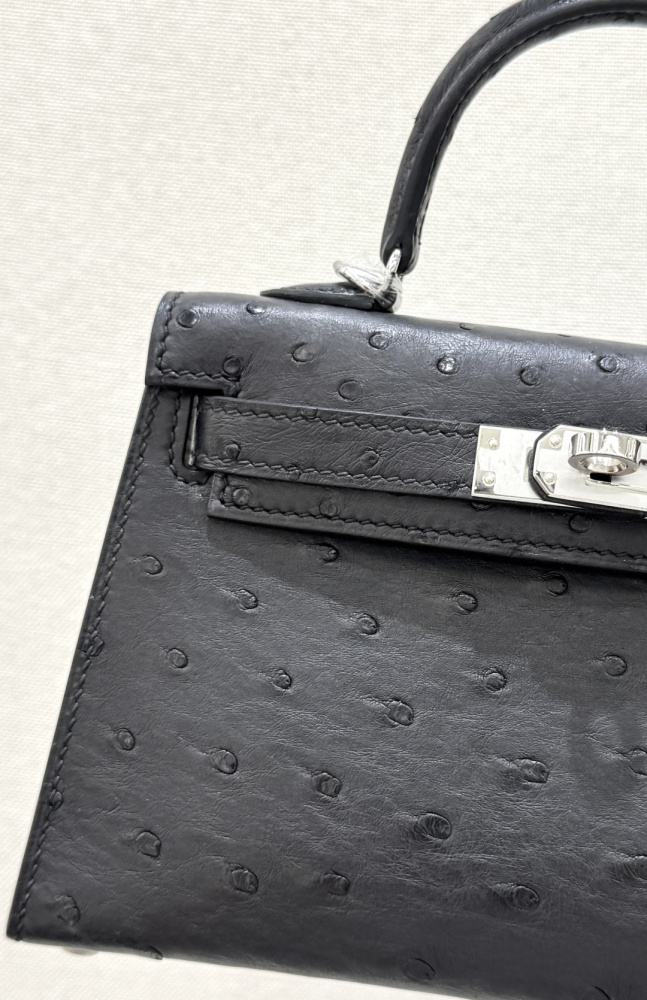 The Hermès Mini Kelly I (also known as the Kelly Pochette) Ostrich Leather Handbag is one of the brand's classic exotic leather models.