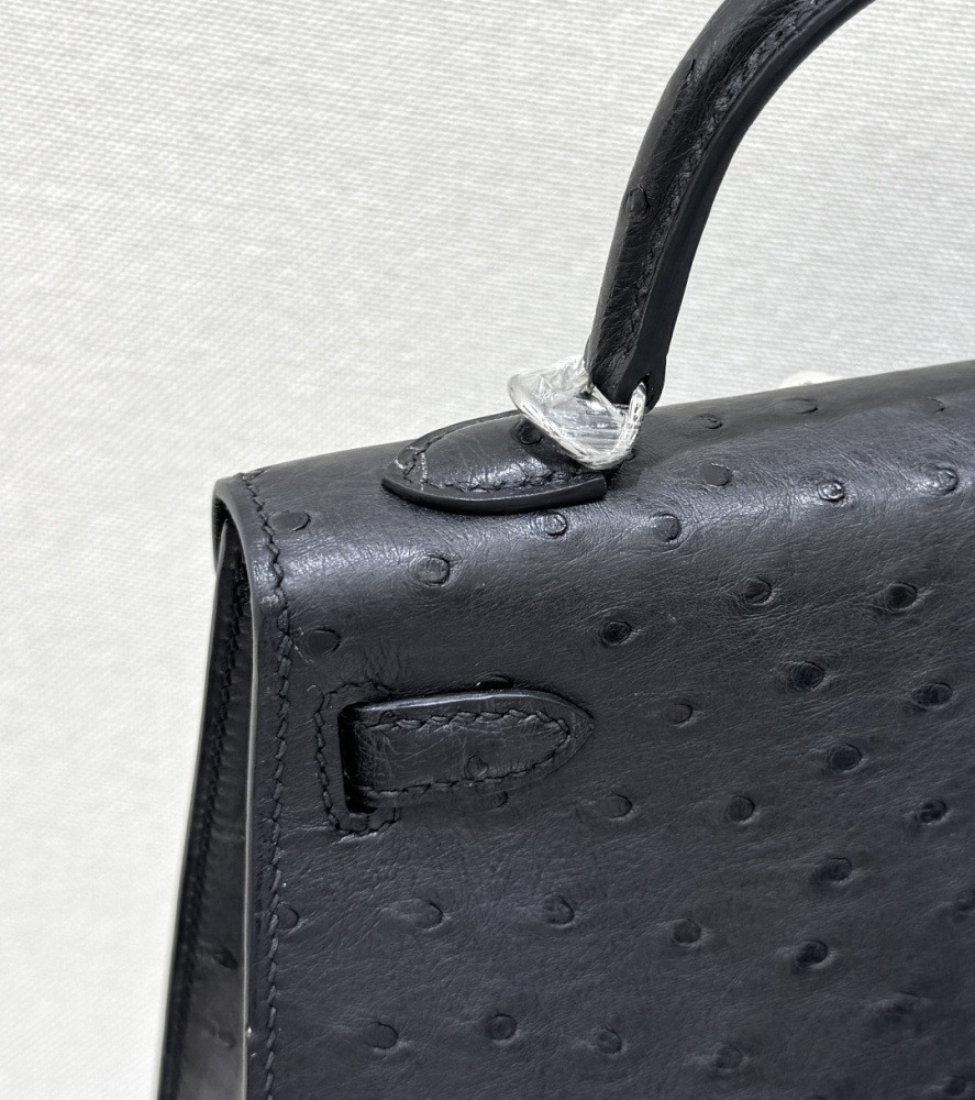 The Hermès Mini Kelly I (also known as the Kelly Pochette) Ostrich Leather Handbag is one of the brand's classic exotic leather models.