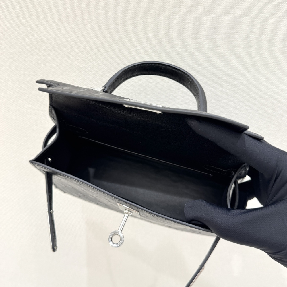 The Hermès Mini Kelly I (also known as the Kelly Pochette) Ostrich Leather Handbag is one of the brand's classic exotic leather models.