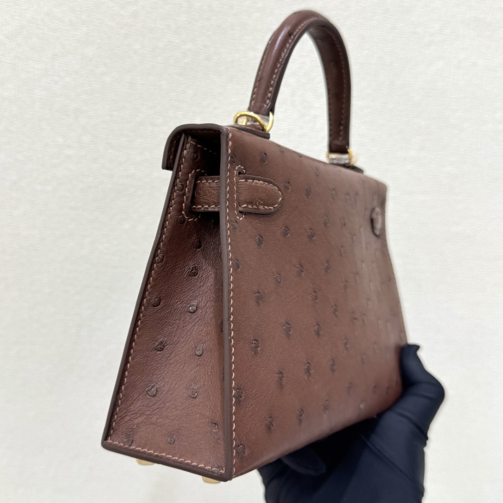 The Hermès Mini Kelly I (also known as the Kelly Pochette) Ostrich Leather Handbag is one of the brand's classic exotic leather models.