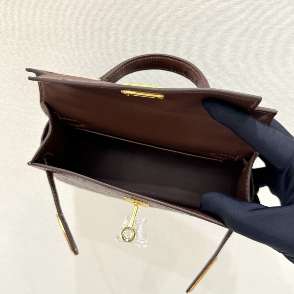 The Hermès Mini Kelly I (also known as the Kelly Pochette) Ostrich Leather Handbag is one of the brand's classic exotic leather models.