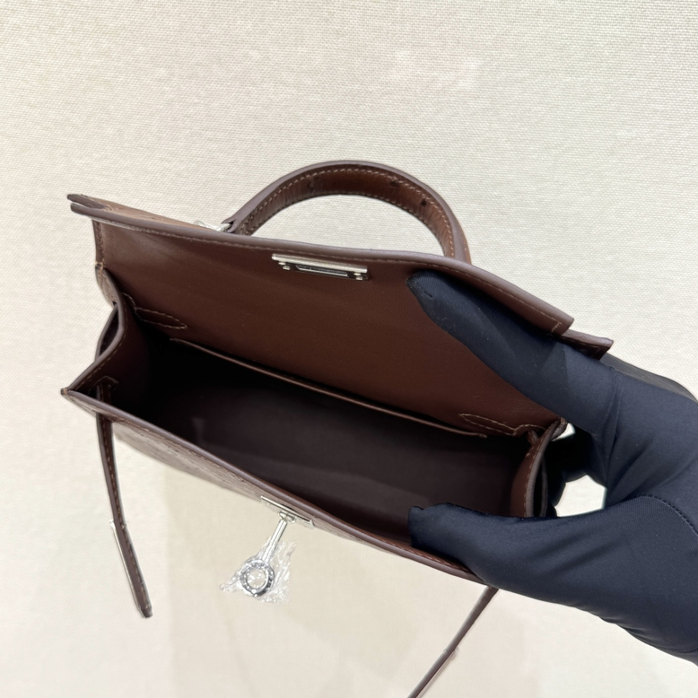 The Hermès Mini Kelly I (also known as the Kelly Pochette) Ostrich Leather Handbag is one of the brand's classic exotic leather models.