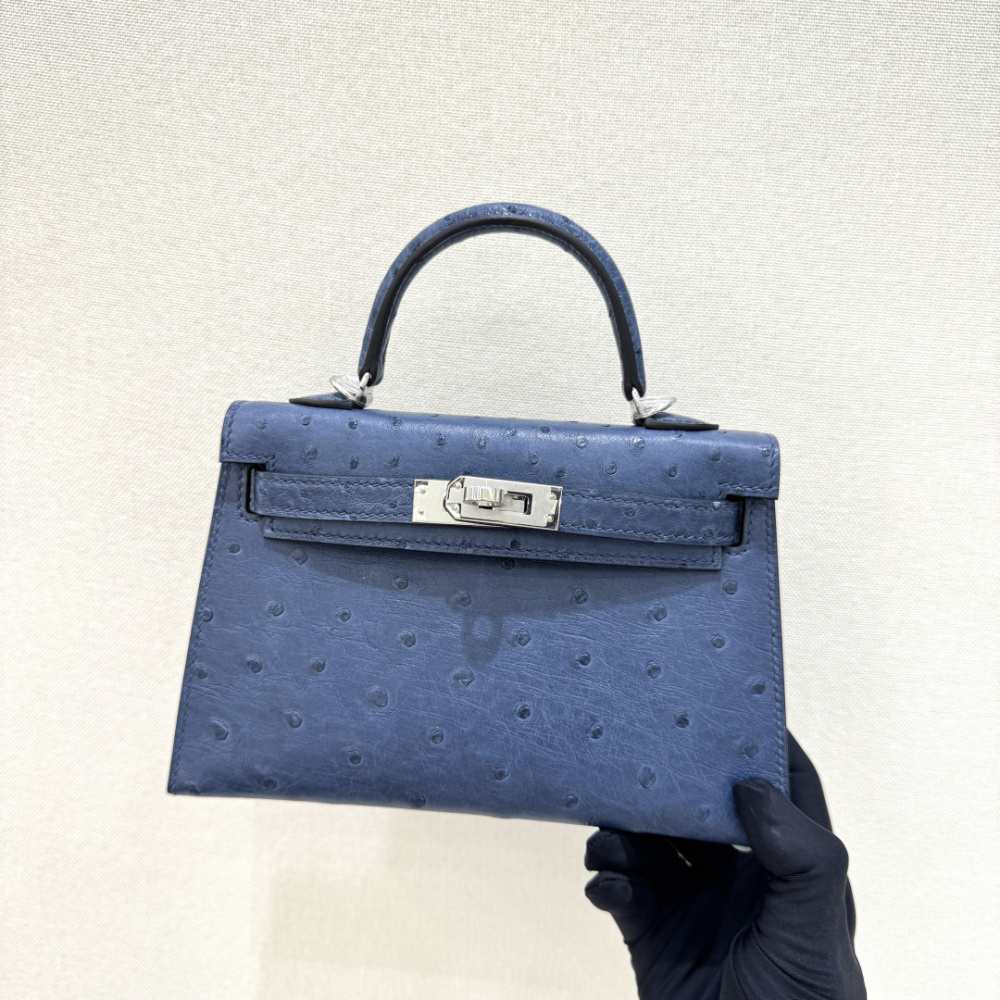 The Hermès Mini Kelly I (also known as the Kelly Pochette) Ostrich Leather Handbag is one of the brand's classic exotic leather models.