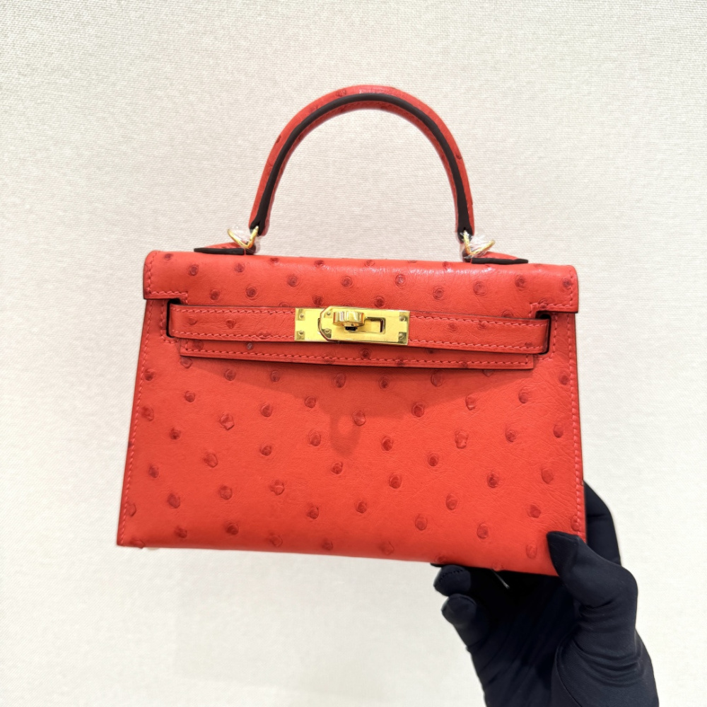 The Hermès Mini Kelly I (also known as the Kelly Pochette) Ostrich Leather Handbag is one of the brand's classic exotic leather models.
