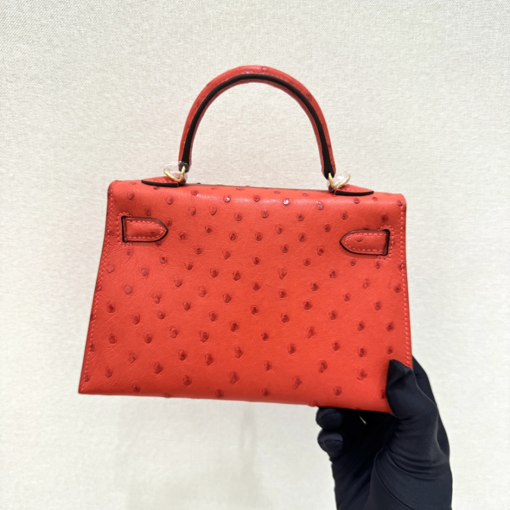 The Hermès Mini Kelly I (also known as the Kelly Pochette) Ostrich Leather Handbag is one of the brand's classic exotic leather models.