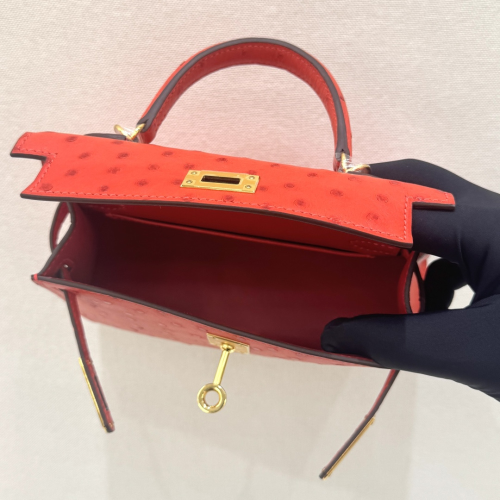 The Hermès Mini Kelly I (also known as the Kelly Pochette) Ostrich Leather Handbag is one of the brand's classic exotic leather models.