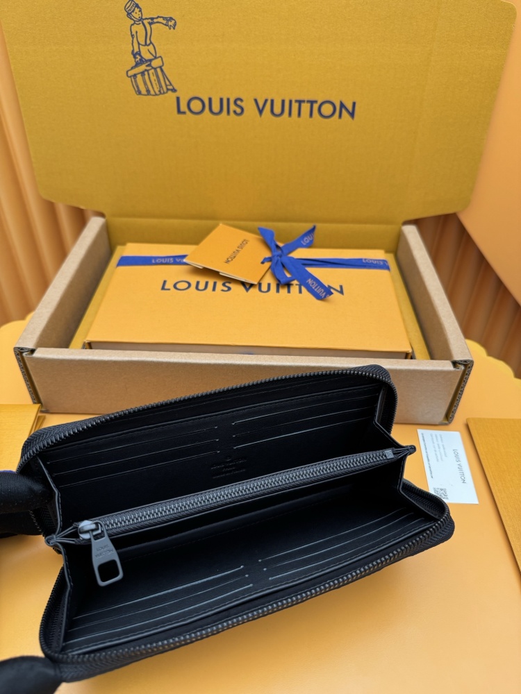 The Louis Vuitton Zippy Wallet, crafted from classic Monogram-embossed Taurillon leather, features an all-black colorway (commonly referred to as "Noir" or "Black Monogram").