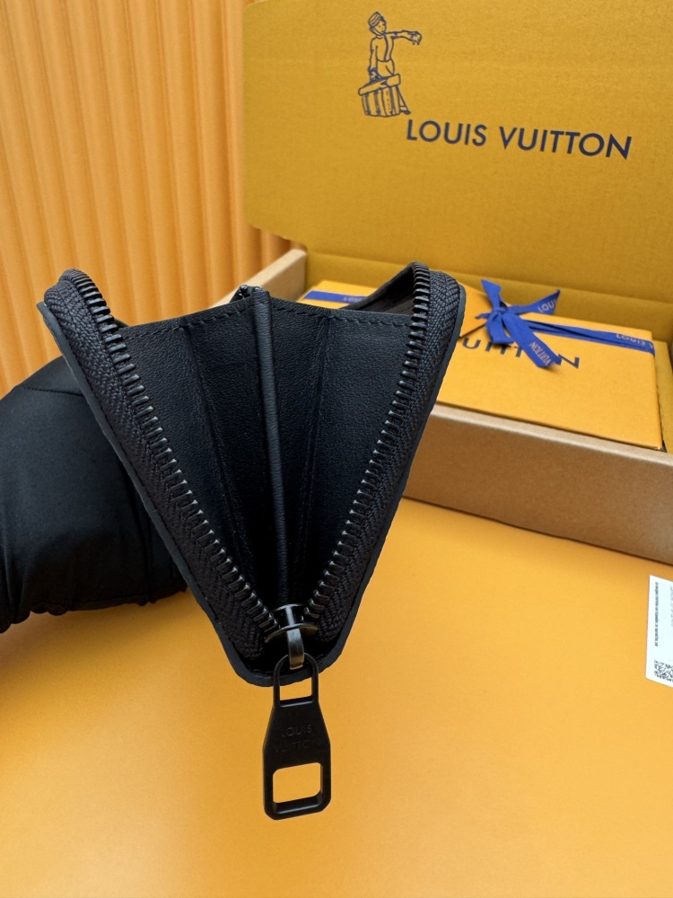 The Louis Vuitton Zippy Wallet, crafted from classic Monogram-embossed Taurillon leather, features an all-black colorway (commonly referred to as "Noir" or "Black Monogram").