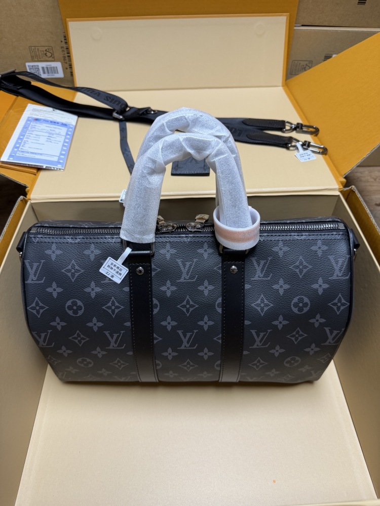 The Louis Vuitton Keepall Bandoulière 35 bag features the classic Monogram Eclipse black and grey canvas.
