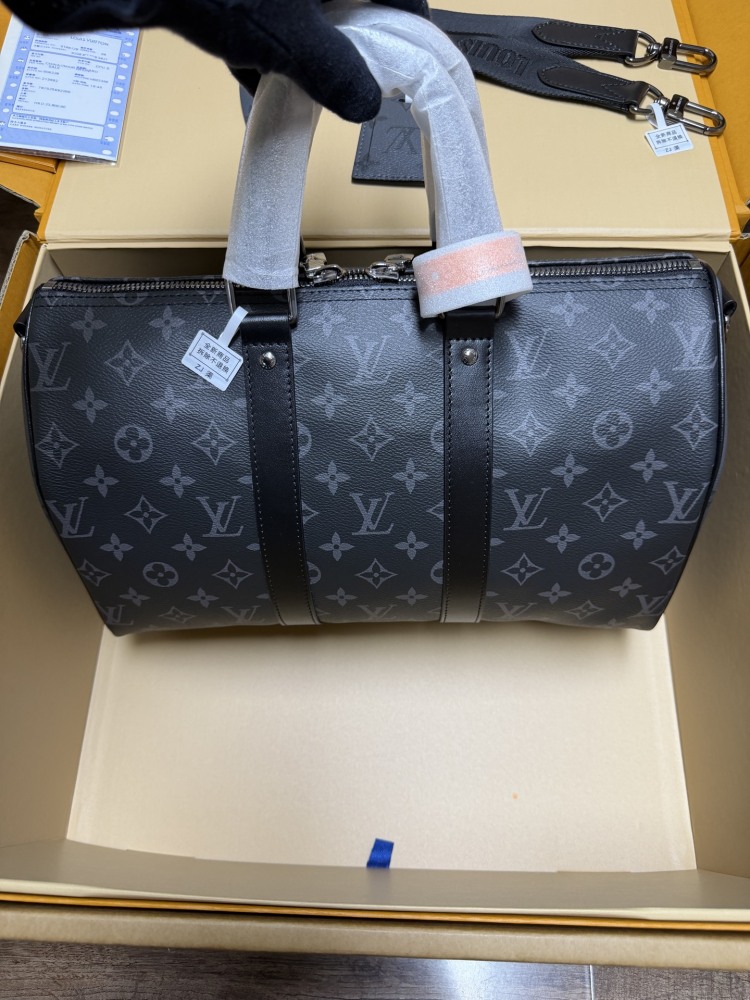 The Louis Vuitton Keepall Bandoulière 35 bag features the classic Monogram Eclipse black and grey canvas.