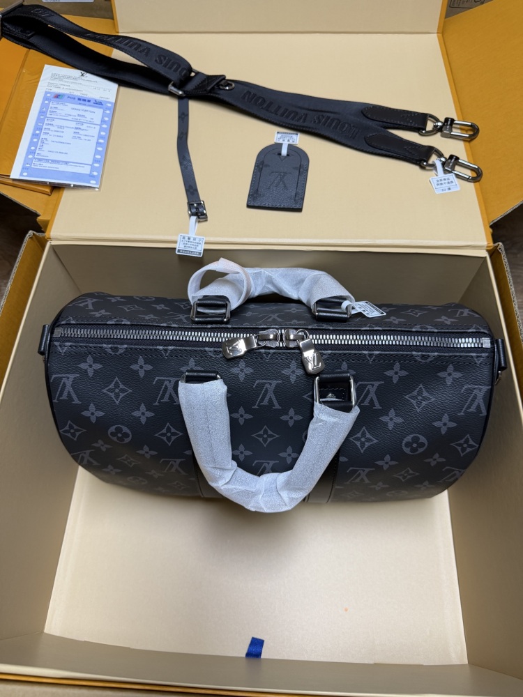 The Louis Vuitton Keepall Bandoulière 35 bag features the classic Monogram Eclipse black and grey canvas.