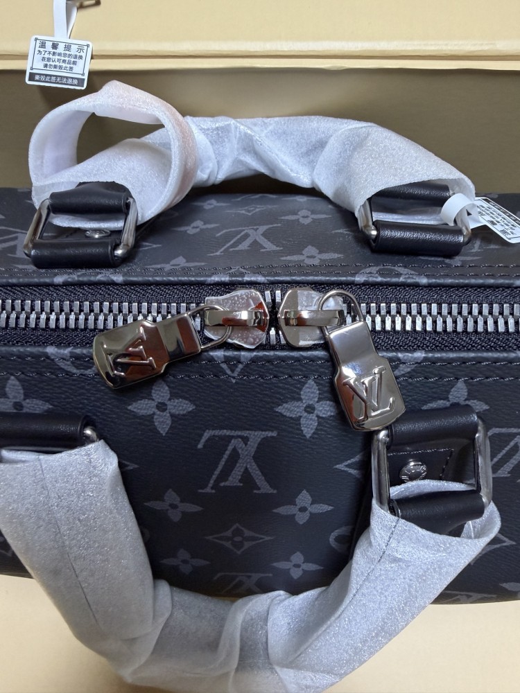 The Louis Vuitton Keepall Bandoulière 35 bag features the classic Monogram Eclipse black and grey canvas.