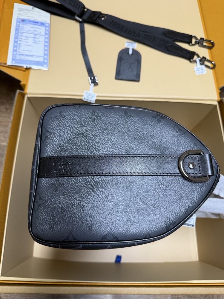 The Louis Vuitton Keepall Bandoulière 35 bag features the classic Monogram Eclipse black and grey canvas.