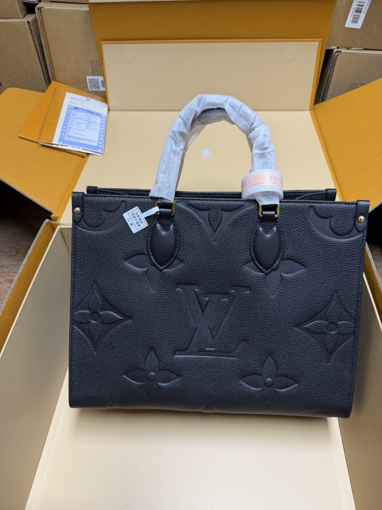 The Louis Vuitton Onthego MM tote bag, featuring an all-black version crafted from embossed Monogram Empreinte cowhide.