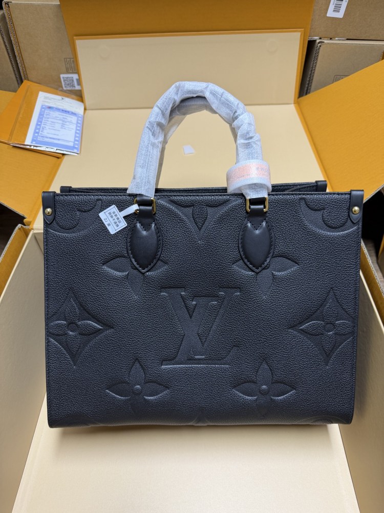 The Louis Vuitton Onthego MM tote bag, featuring an all-black version crafted from embossed Monogram Empreinte cowhide.