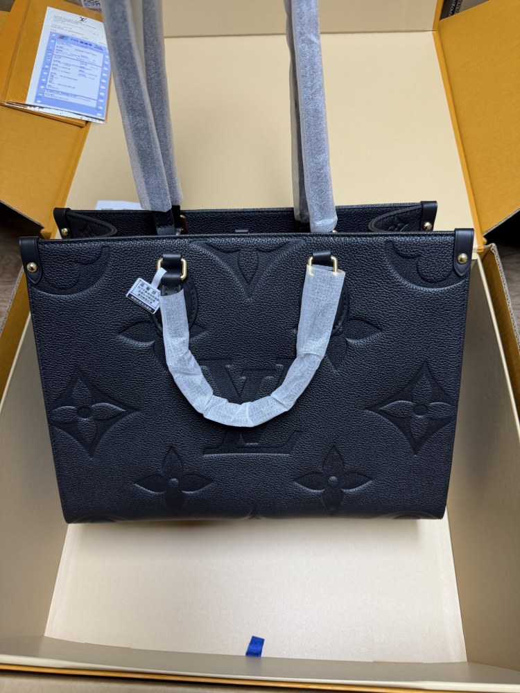 The Louis Vuitton Onthego MM tote bag, featuring an all-black version crafted from embossed Monogram Empreinte cowhide.