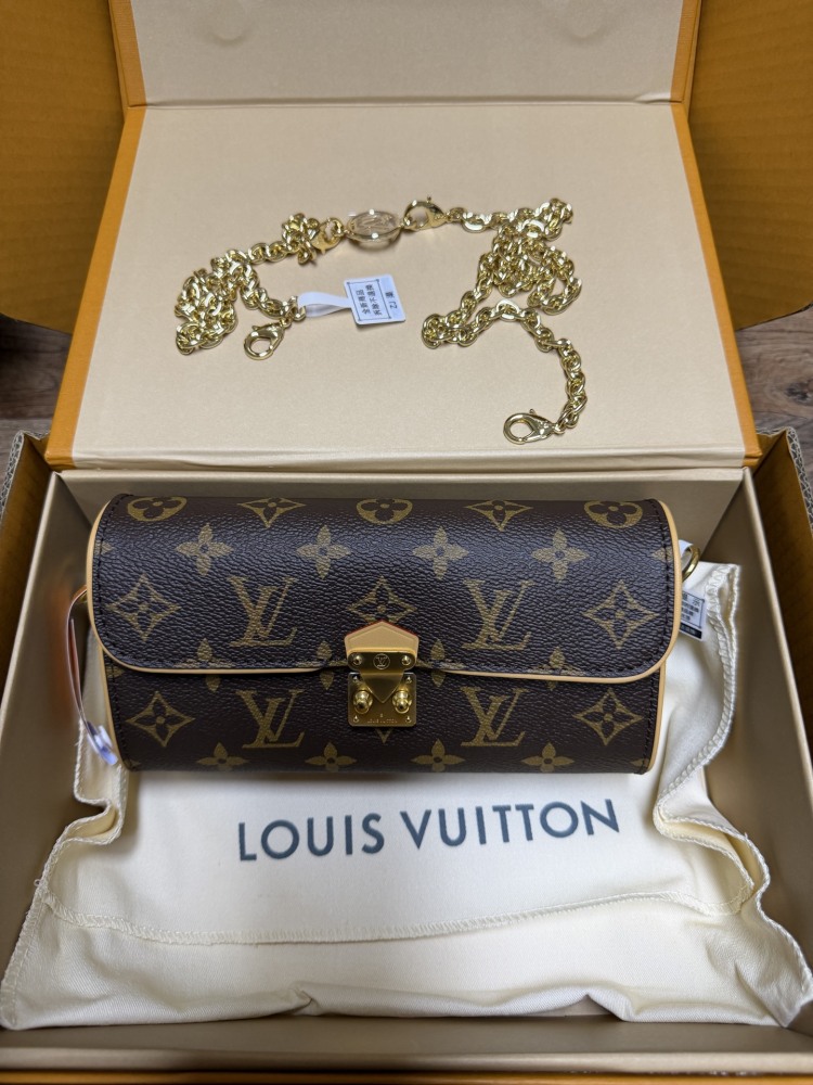 The Louis Vuitton LV East-West Mini Chain Bag (colloquially known as the "Mini Papillon") is crafted from the classic Monogram canvas.