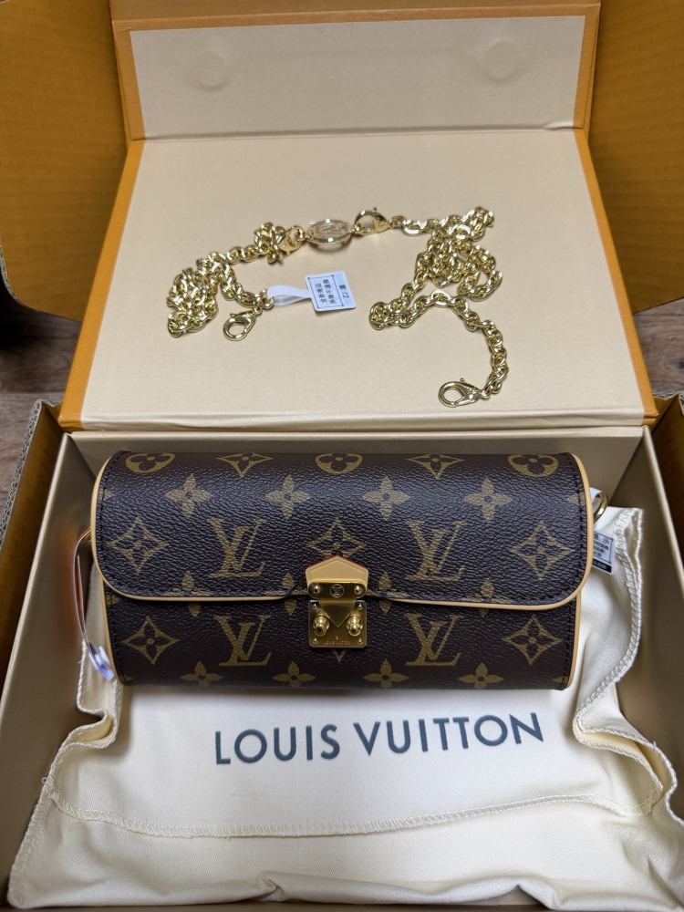 The Louis Vuitton LV East-West Mini Chain Bag (colloquially known as the "Mini Papillon") is crafted from the classic Monogram canvas.