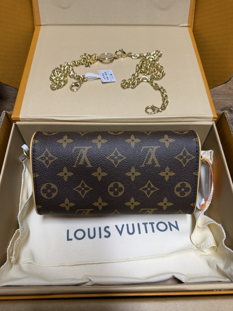 The Louis Vuitton LV East-West Mini Chain Bag (colloquially known as the "Mini Papillon") is crafted from the classic Monogram canvas.