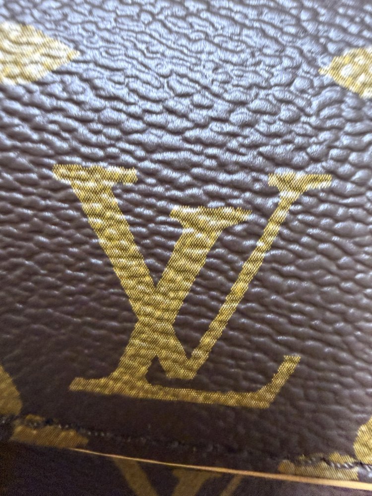 The Louis Vuitton LV East-West Mini Chain Bag (colloquially known as the "Mini Papillon") is crafted from the classic Monogram canvas.