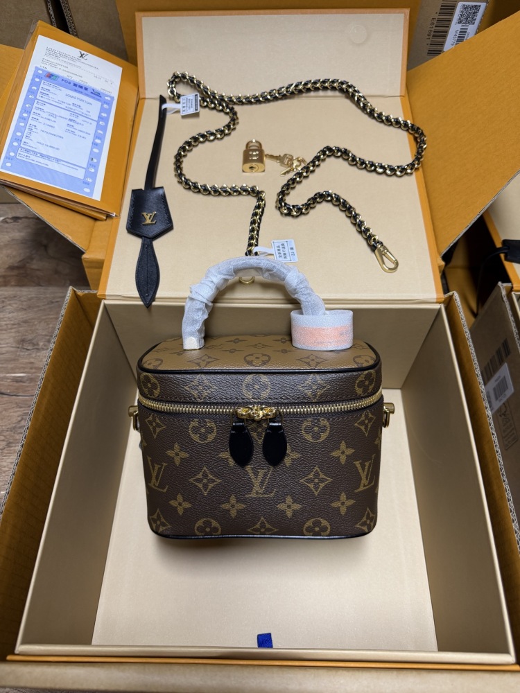 The Louis Vuitton Vanity Small Handbag (Cosmetic Case Style) features the classic Monogram canvas paired with gold-tone hardware.