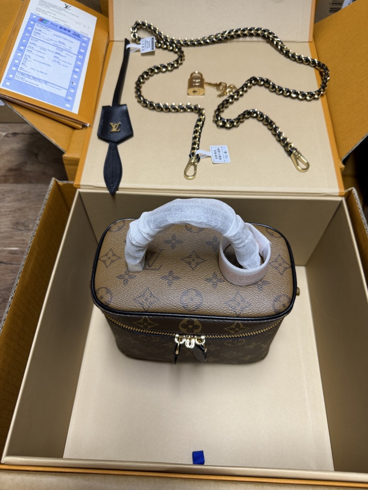 The Louis Vuitton Vanity Small Handbag (Cosmetic Case Style) features the classic Monogram canvas paired with gold-tone hardware.