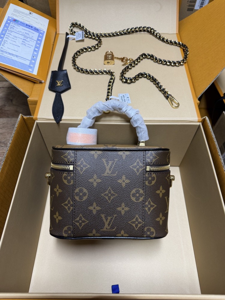 The Louis Vuitton Vanity Small Handbag (Cosmetic Case Style) features the classic Monogram canvas paired with gold-tone hardware.