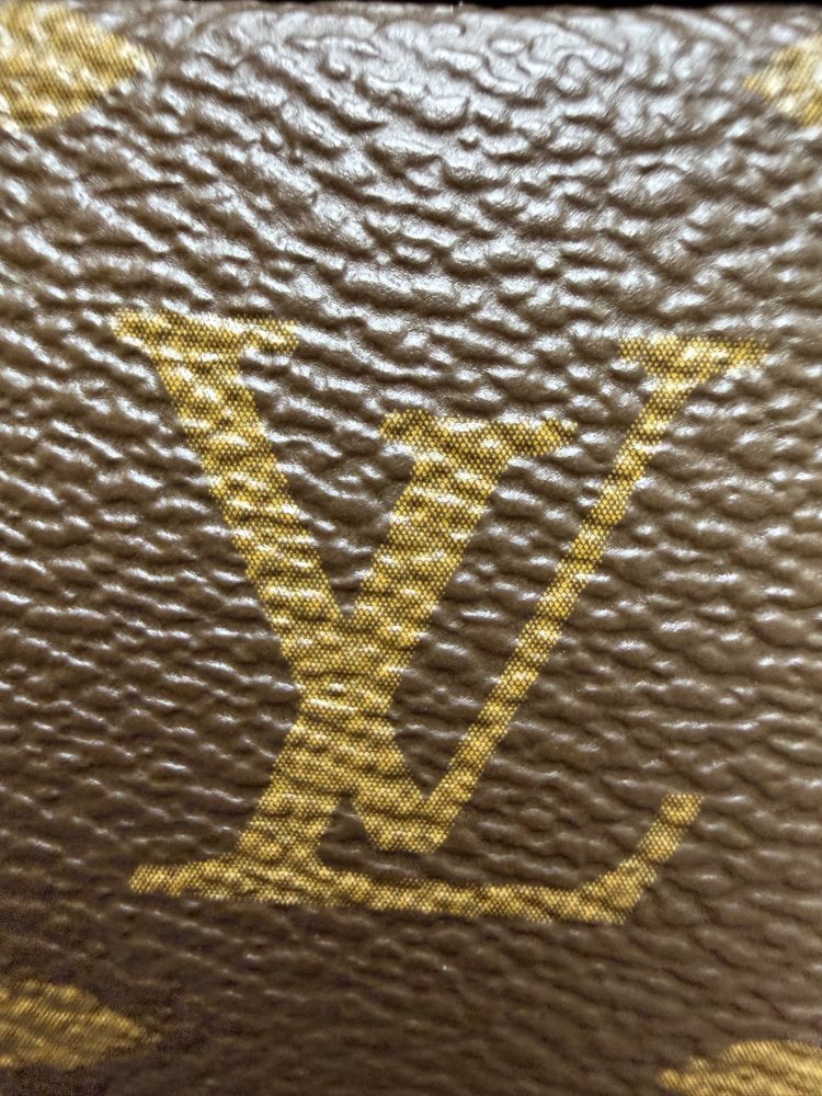 The Louis Vuitton Vanity Small Handbag (Cosmetic Case Style) features the classic Monogram canvas paired with gold-tone hardware.