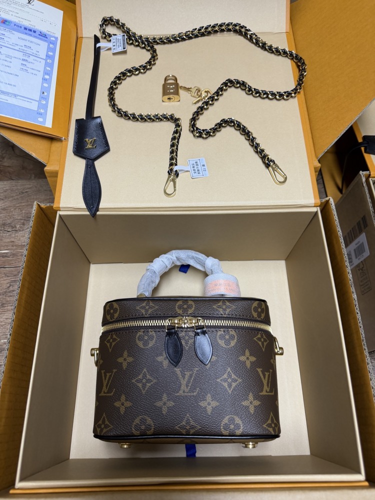 The Louis Vuitton Vanity Small Handbag (Cosmetic Case Style) features the classic Monogram canvas paired with gold-tone hardware.