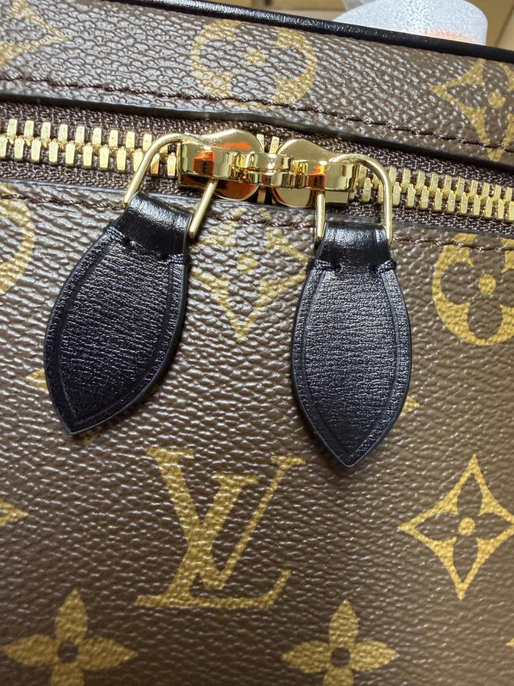 The Louis Vuitton Vanity Small Handbag (Cosmetic Case Style) features the classic Monogram canvas paired with gold-tone hardware.