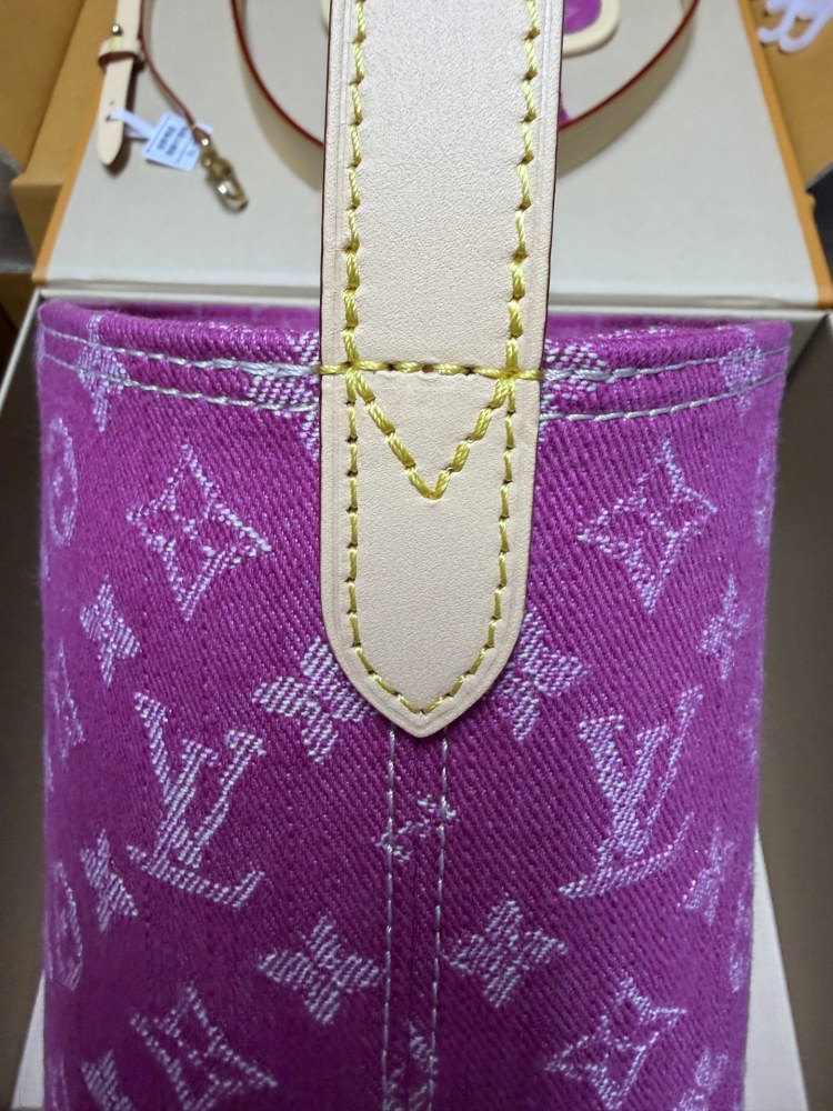 The Louis Vuitton Vanity Small Handbag (Vanity Case style) is crafted from the brand's classic Monogram-printed pink denim canvas, accented with natural cowhide trim and gold-tone hardware.
