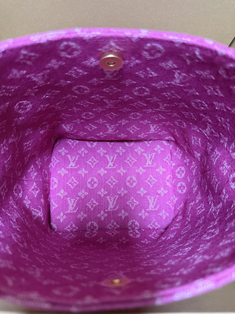 The Louis Vuitton Vanity Small Handbag (Vanity Case style) is crafted from the brand's classic Monogram-printed pink denim canvas, accented with natural cowhide trim and gold-tone hardware.