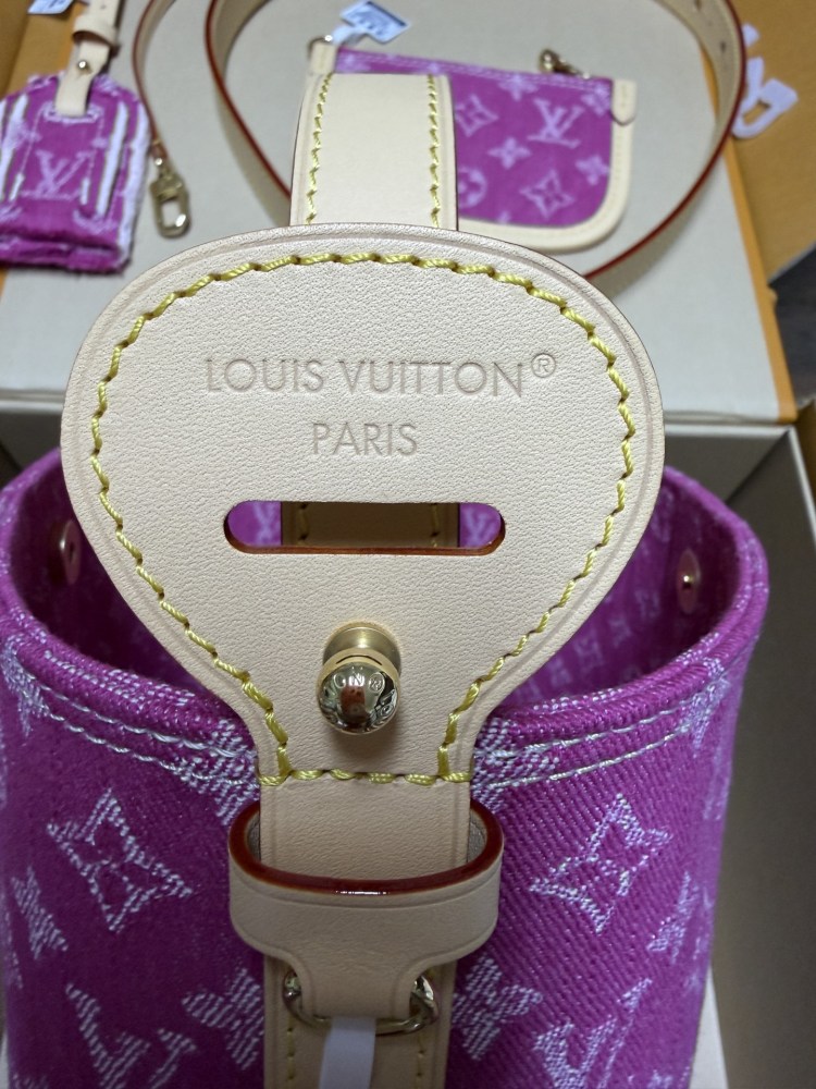 The Louis Vuitton Vanity Small Handbag (Vanity Case style) is crafted from the brand's classic Monogram-printed pink denim canvas, accented with natural cowhide trim and gold-tone hardware.