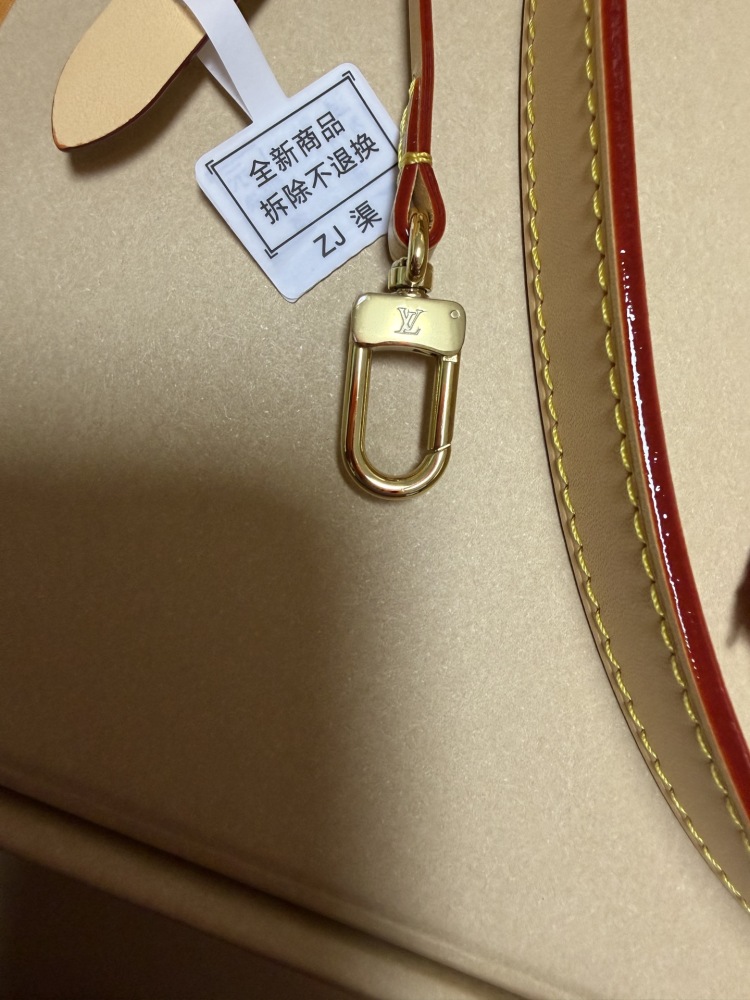 The Louis Vuitton Vanity Small Handbag (Vanity Case style) is crafted from the brand's classic Monogram-printed pink denim canvas, accented with natural cowhide trim and gold-tone hardware.