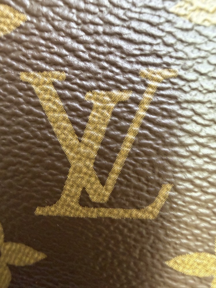 The classic Louis Vuitton Cosmetic Pouch features the brand's iconic Monogram coated canvas.