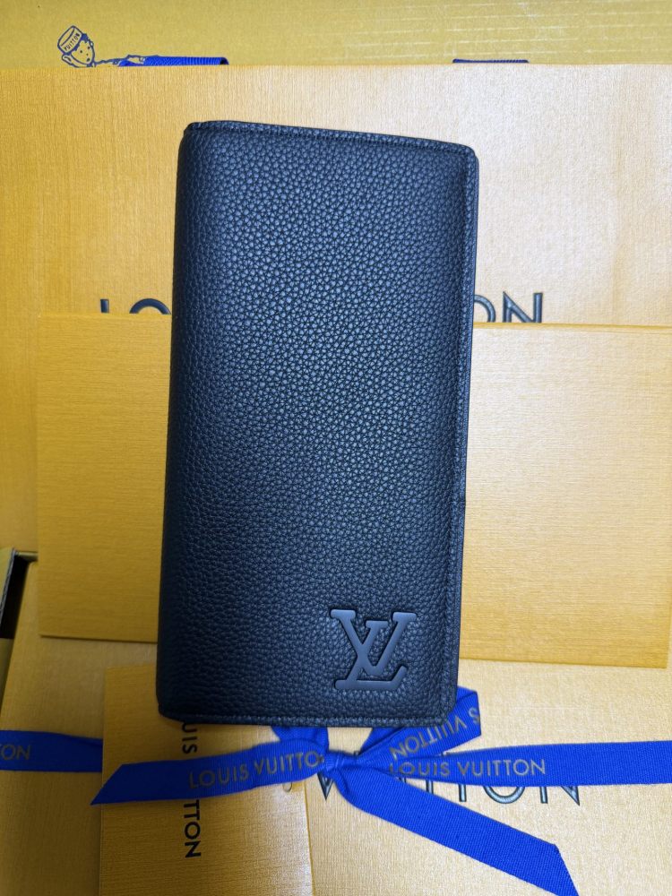 The Louis Vuitton LV Aerogram long bi-fold wallet is crafted from grained cowhide leather, a material specifically developed by the brand for men.